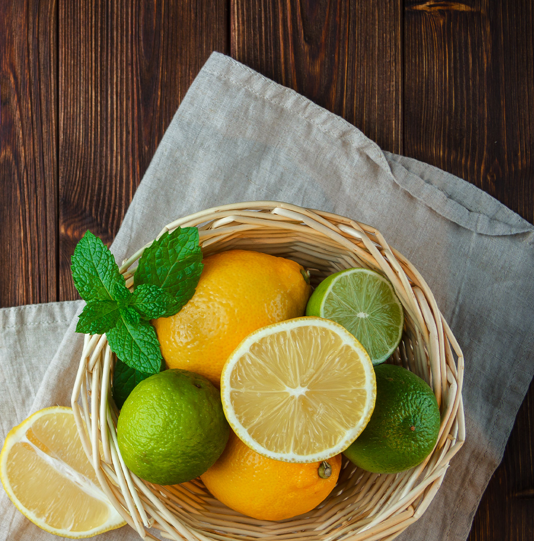 lemon, limes and oranges in a basket